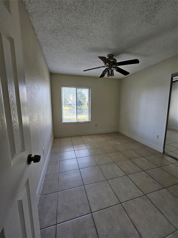 8290 Butterfield Lane Boca Raton, FL 33433 - Photo 33 of 38 a view of an empty room with a window