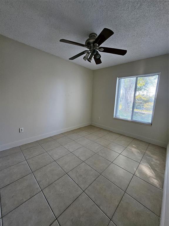 8290 Butterfield Lane Boca Raton, FL 33433 - Photo 34 of 38 a view of an empty room and window