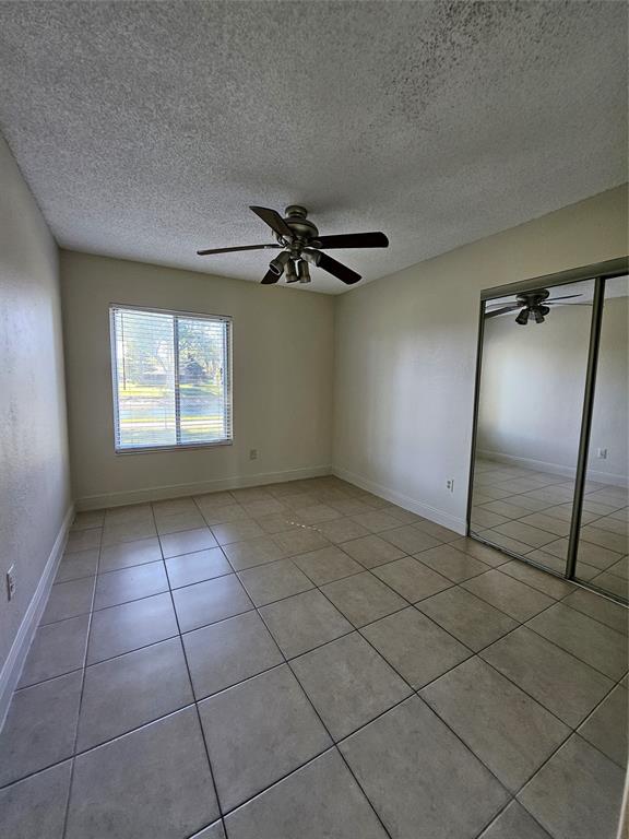 8290 Butterfield Lane Boca Raton, FL 33433 - Photo 36 of 38 a view of an empty room with a window