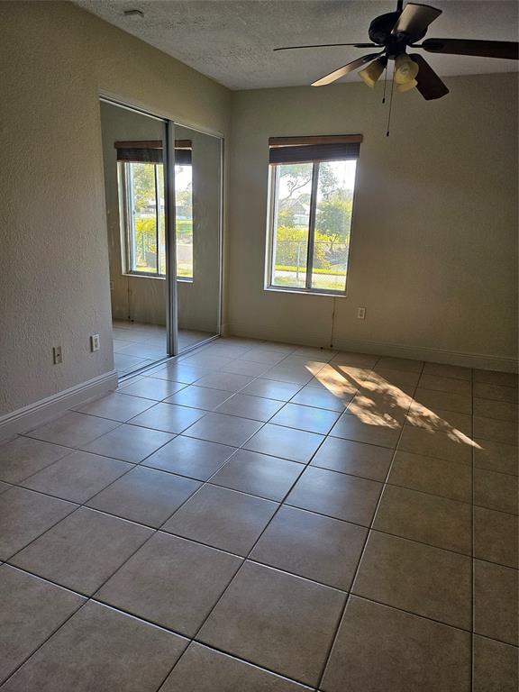 8290 Butterfield Lane Boca Raton, FL 33433 - Photo 37 of 38 a view of an empty room with a window