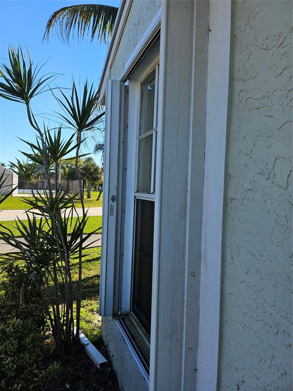 8290 Butterfield Lane Boca Raton, FL 33433 - Photo 5 of 38 a view of a backyard of a house with a tree