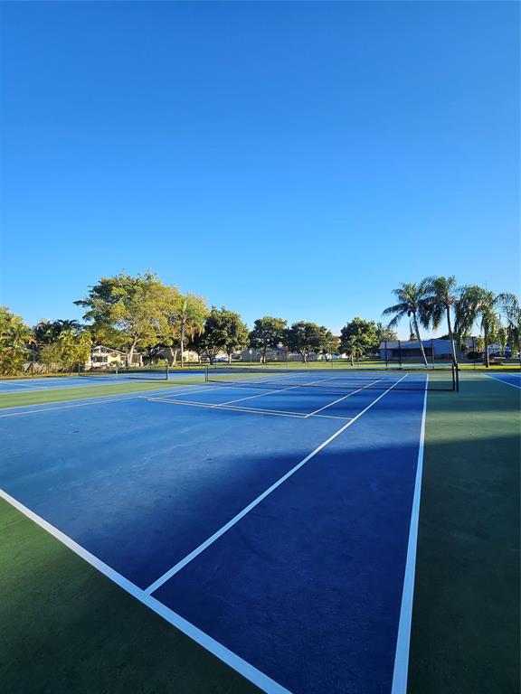 8290 Butterfield Lane Boca Raton, FL 33433 - Photo 10 of 38 a view of outdoor space and tennis court