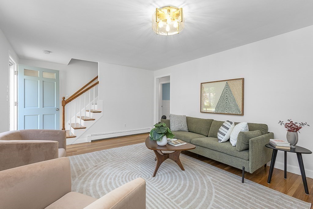 117 Oak Ridge Drive Ayer, MA 01432 - Photo 4 of 26 a living room with furniture and a wooden floor