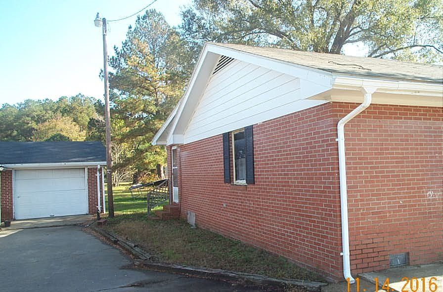 495 Devils Racetrack Road Four Oaks, NC 27524 - Photo 16 of 16 left side of home