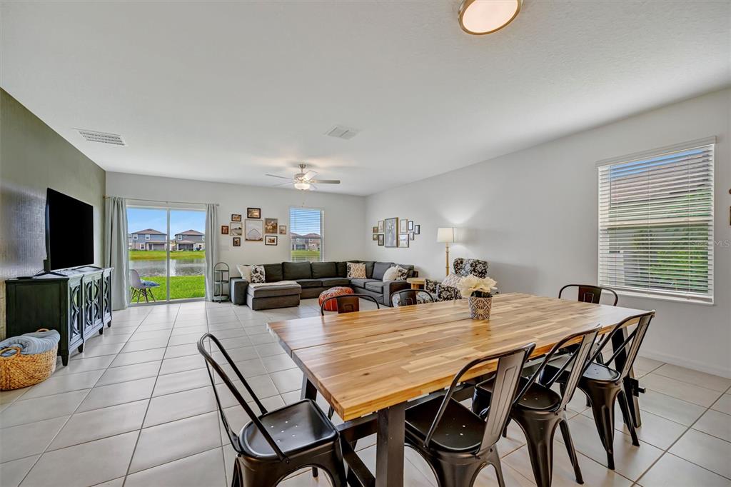 11112 Linden Depot Road San Antonio, FL 33576 - Photo 19 of 82 a view of a dining room with furniture and wooden floor