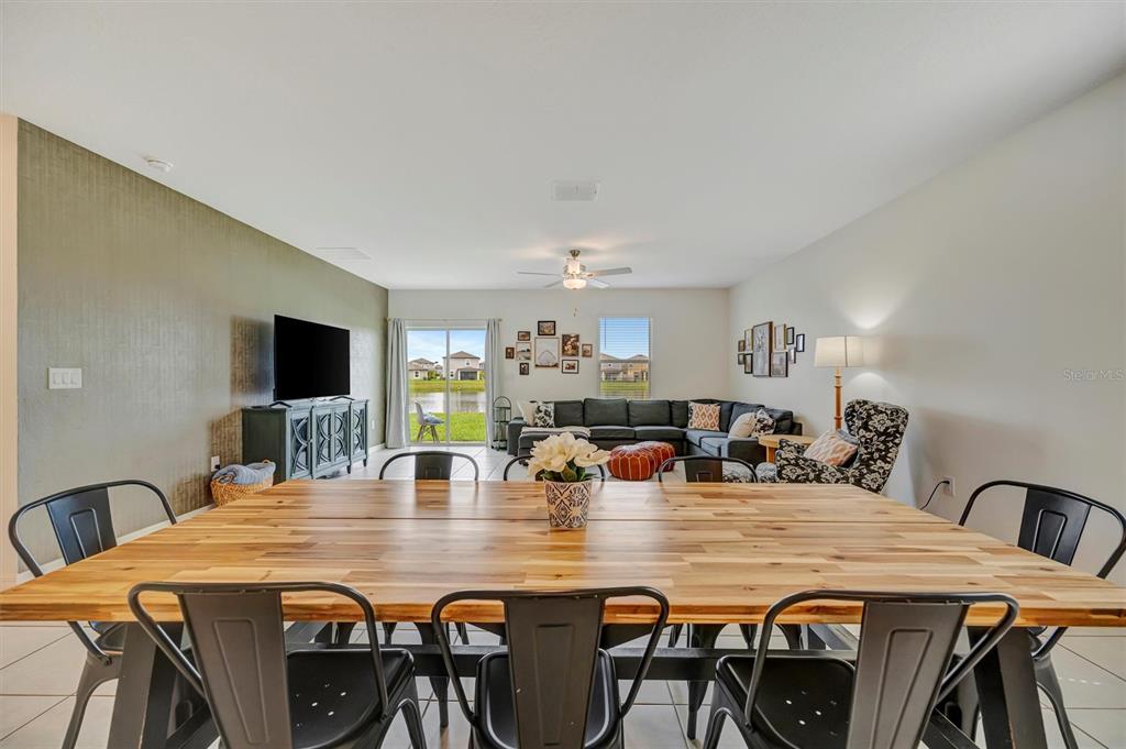 11112 Linden Depot Road San Antonio, FL 33576 - Photo 20 of 82 a view of a dining room with furniture and wooden floor
