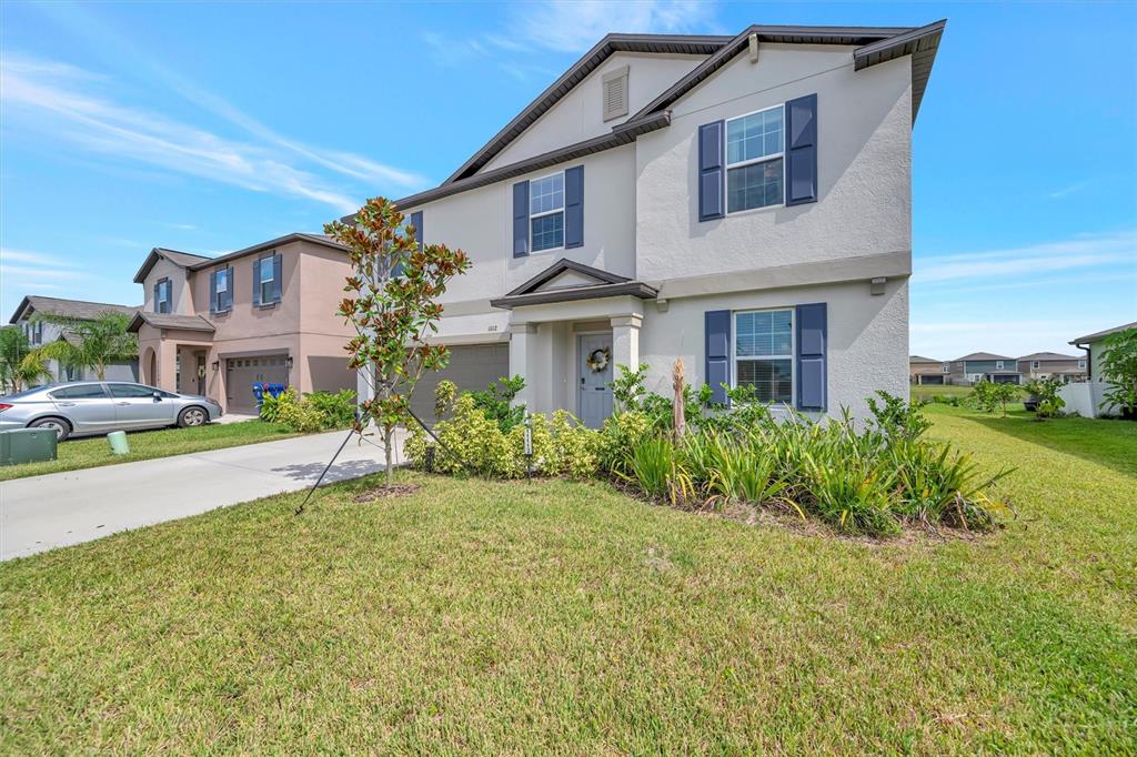11112 Linden Depot Road San Antonio, FL 33576 - Photo 2 of 82 a front view of a house with a yard