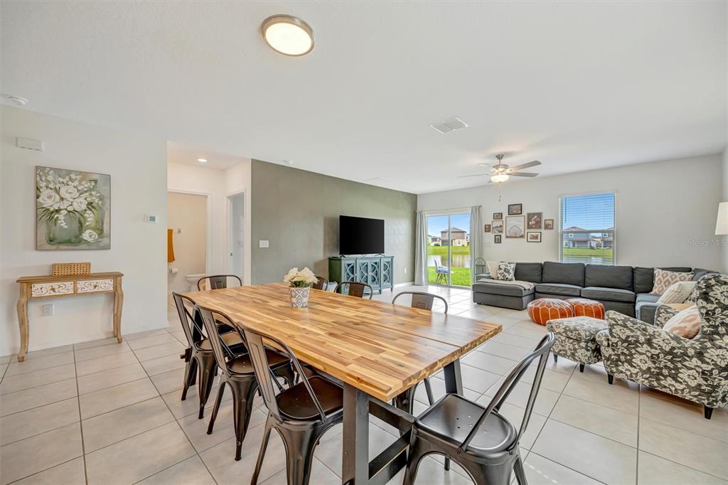 11112 Linden Depot Road San Antonio, FL 33576 - Photo 21 of 82 a view of a dining room with furniture and a kitchen