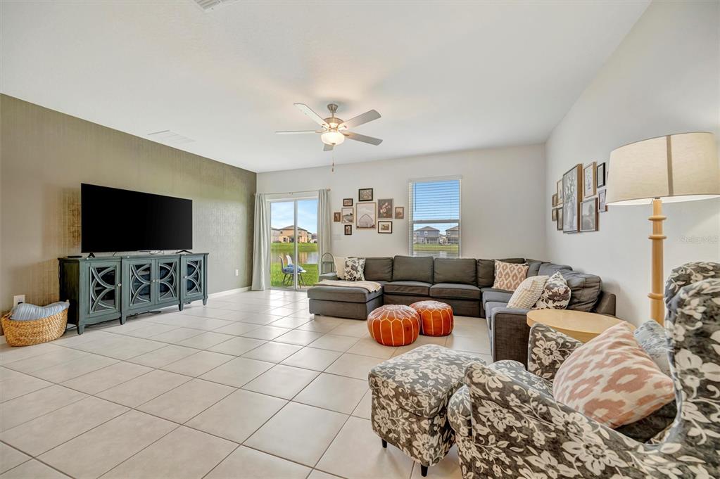 11112 Linden Depot Road San Antonio, FL 33576 - Photo 22 of 82 a living room with furniture and a flat screen tv