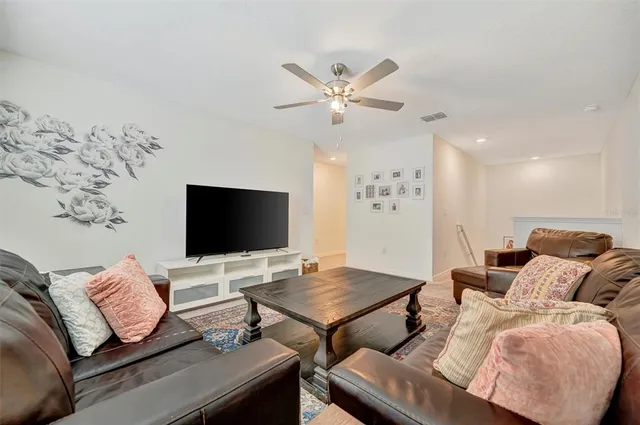 a spacious bathroom with a granite countertop sink and a mirror