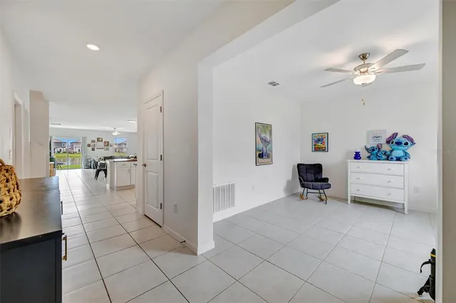 a view of a livingroom with kitchen and furniture