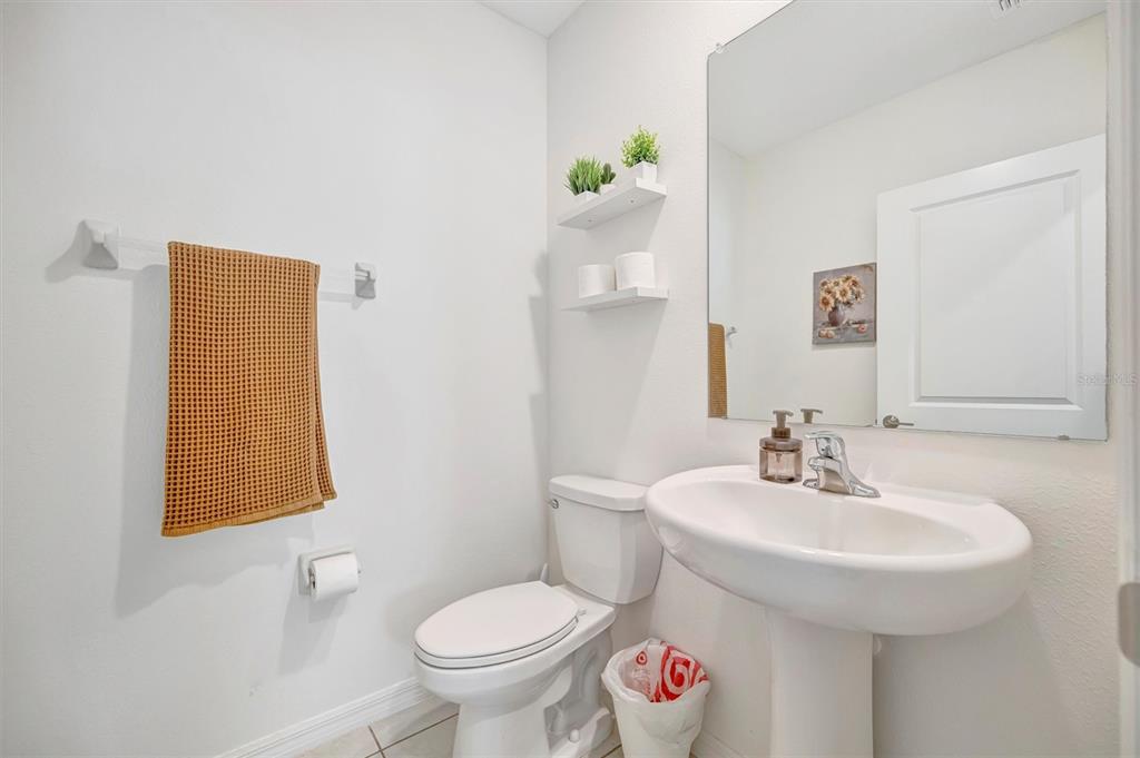 11112 Linden Depot Road San Antonio, FL 33576 - Photo 35 of 82 a bathroom with a sink toilet and a mirror