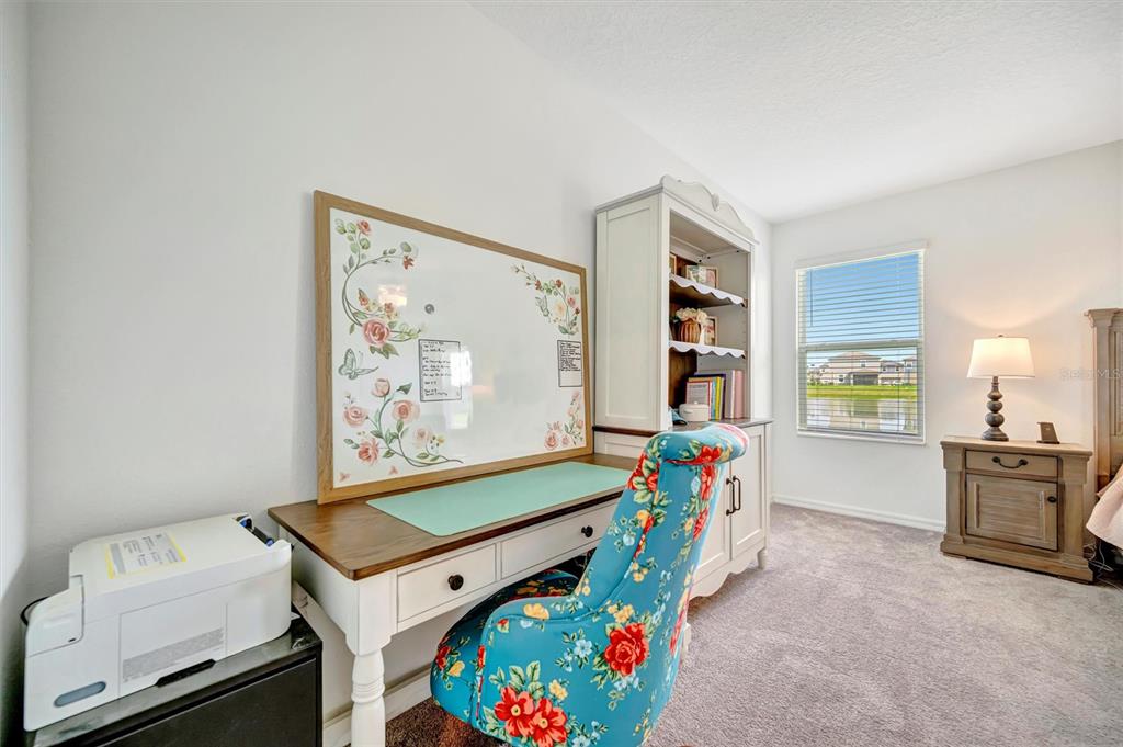 11112 Linden Depot Road San Antonio, FL 33576 - Photo 41 of 82 a room with furniture and flat screen tv