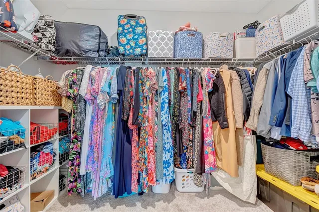 a view of an chairs and table in front of a house