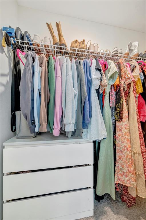 11112 Linden Depot Road San Antonio, FL 33576 - Photo 57 of 82 a view of walk in closet with clothes