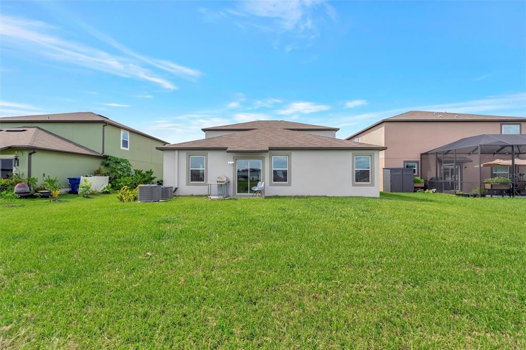 11112 Linden Depot Road San Antonio, FL 33576 - Photo 64 of 82 a view of a house with a back yard