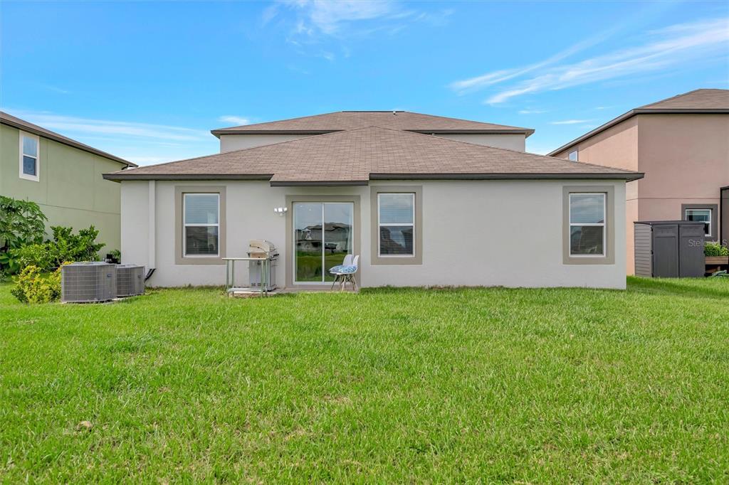 11112 Linden Depot Road San Antonio, FL 33576 - Photo 65 of 82 a view of a house with backyard porch and garden