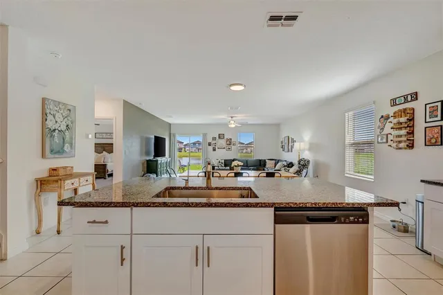 a kitchen with counter top space and cabinets