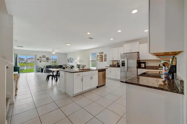 a kitchen with sink and center island