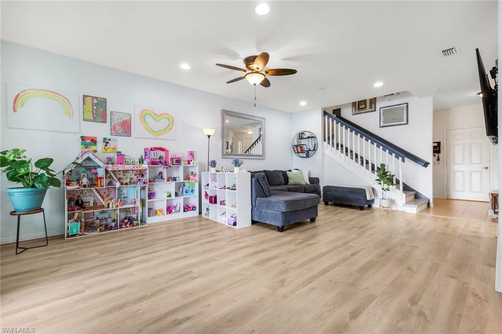 15239 Summit Pl Circle, Unit 246 Naples, FL 34119 - Photo 11 of 49 Playroom featuring a ceiling fan, light wood finished floors, and recessed lighting