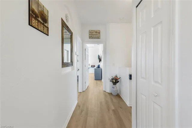 a view of a dining room with furniture and a book shelf