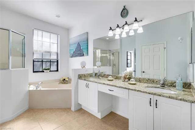 a bathroom with a sink a mirror and a shower