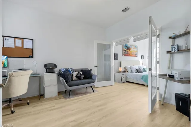 a bathroom with a granite countertop sink mirror and a bathtub
