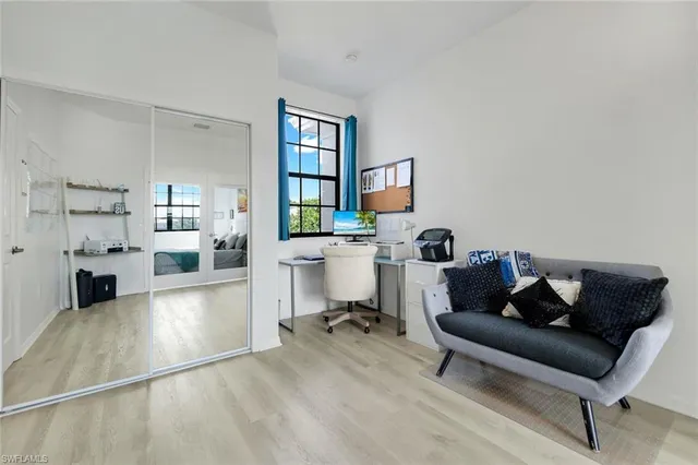 a living room with furniture and a chair