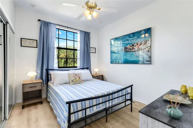 a bedroom with a bed and a desk