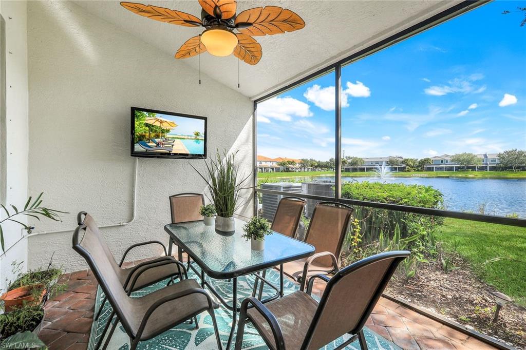 15239 Summit Pl Circle, Unit 246 Naples, FL 34119 - Photo 33 of 49 Sunroom / solarium with a textured wall and vaulted ceiling