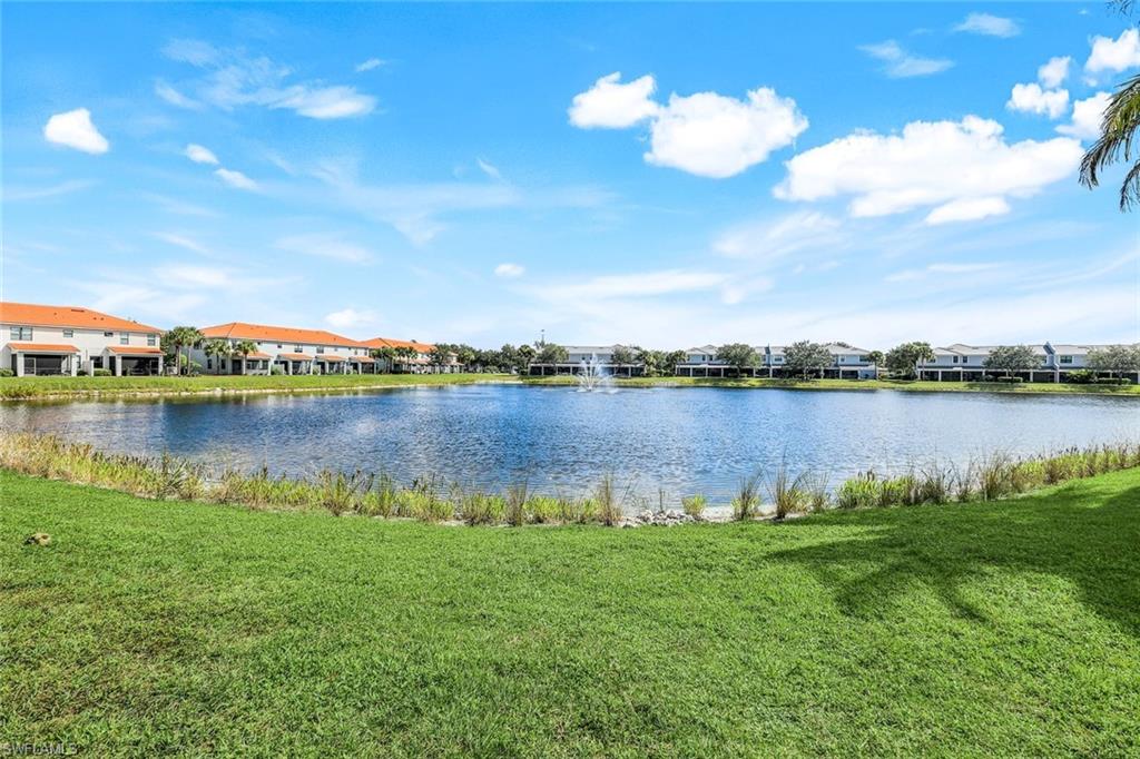 15239 Summit Pl Circle, Unit 246 Naples, FL 34119 - Photo 36 of 49 Water view with nearby suburban area