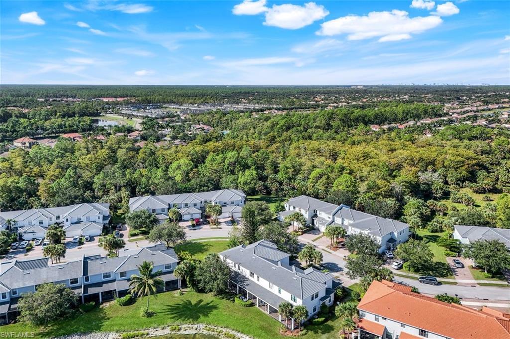 15239 Summit Pl Circle, Unit 246 Naples, FL 34119 - Photo 41 of 49 Aerial perspective of suburban area