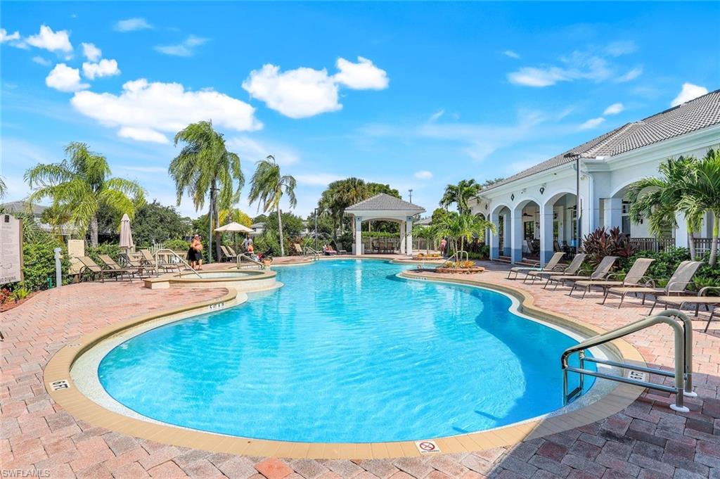 15239 Summit Pl Circle, Unit 246 Naples, FL 34119 - Photo 42 of 49 Community pool with a gazebo and a patio