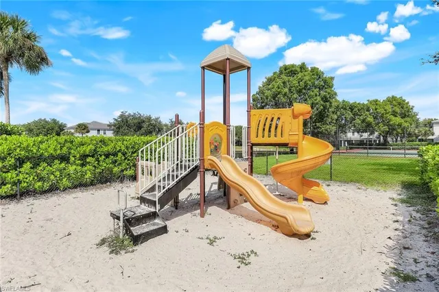 a view of a swimming pool with outdoor seating