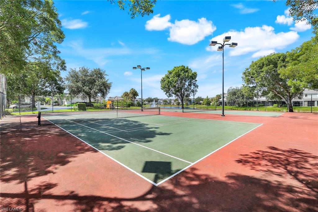 15239 Summit Pl Circle, Unit 246 Naples, FL 34119 - Photo 44 of 49 View of tennis court with community basketball court