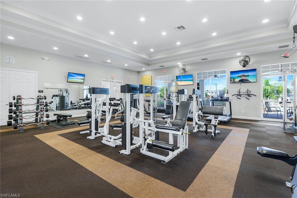 15239 Summit Pl Circle, Unit 246 Naples, FL 34119 - Photo 46 of 49 Exercise room with ornamental molding and recessed lighting