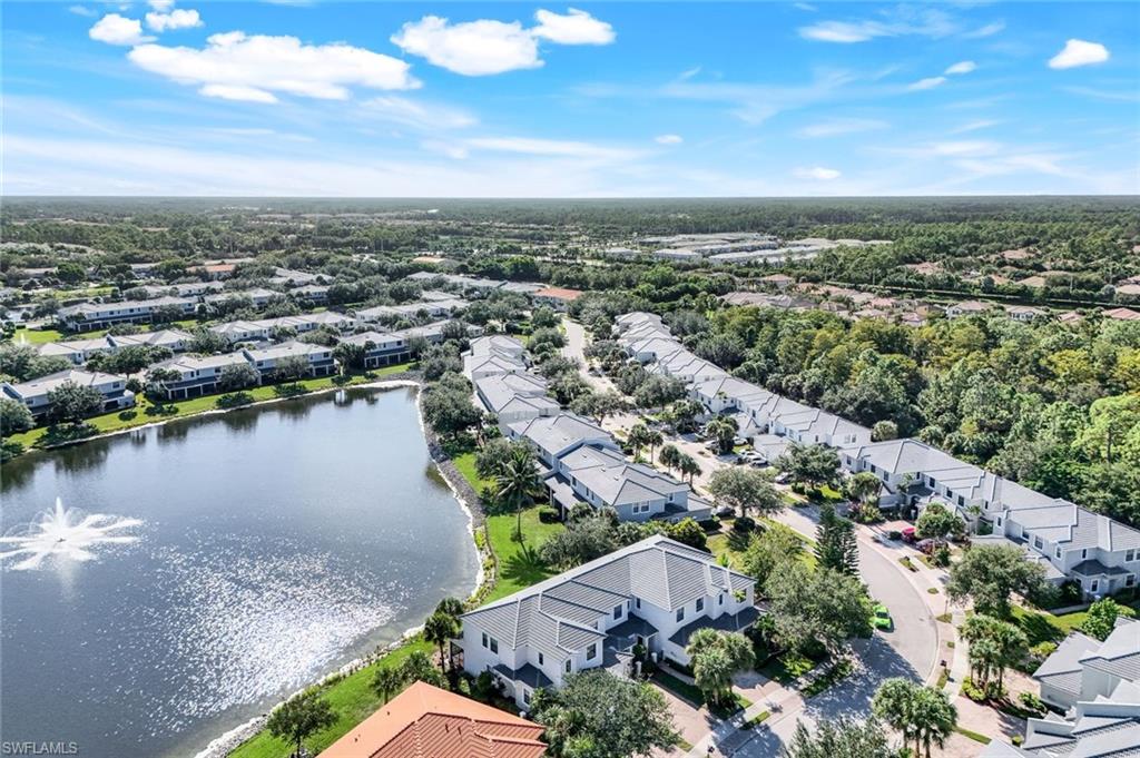 15239 Summit Pl Circle, Unit 246 Naples, FL 34119 - Photo 47 of 49 Aerial perspective of suburban area featuring a nearby body of water