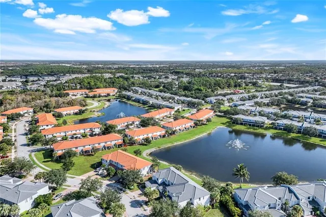 an aerial view of a house with a lake view