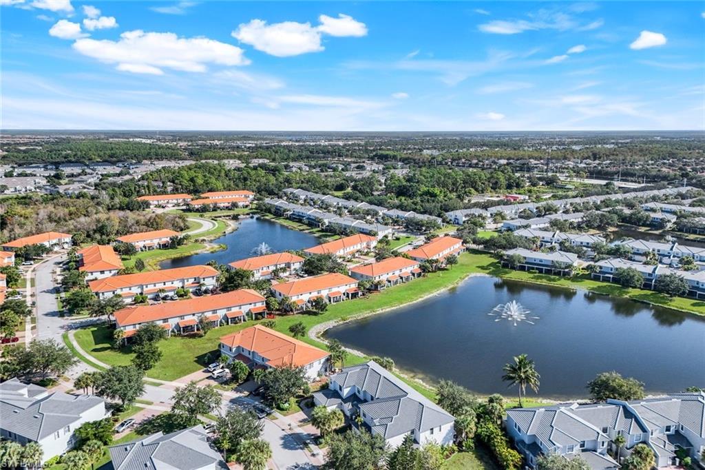 15239 Summit Pl Circle, Unit 246 Naples, FL 34119 - Photo 48 of 49 Aerial view of residential area with a large body of water