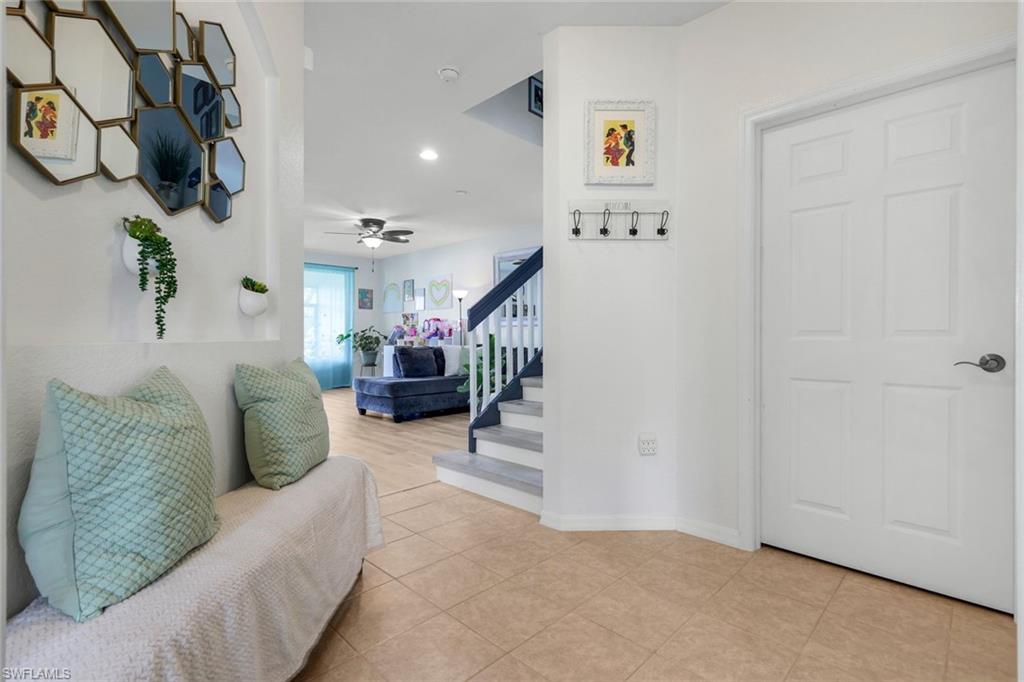 15239 Summit Pl Circle, Unit 246 Naples, FL 34119 - Photo 7 of 49 Entryway featuring stairs, recessed lighting, light tile patterned floors, and a ceiling fan