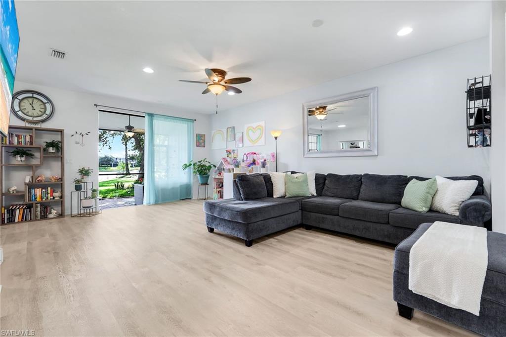 15239 Summit Pl Circle, Unit 246 Naples, FL 34119 - Photo 8 of 49 Living area with wood finished floors, ceiling fan, and recessed lighting