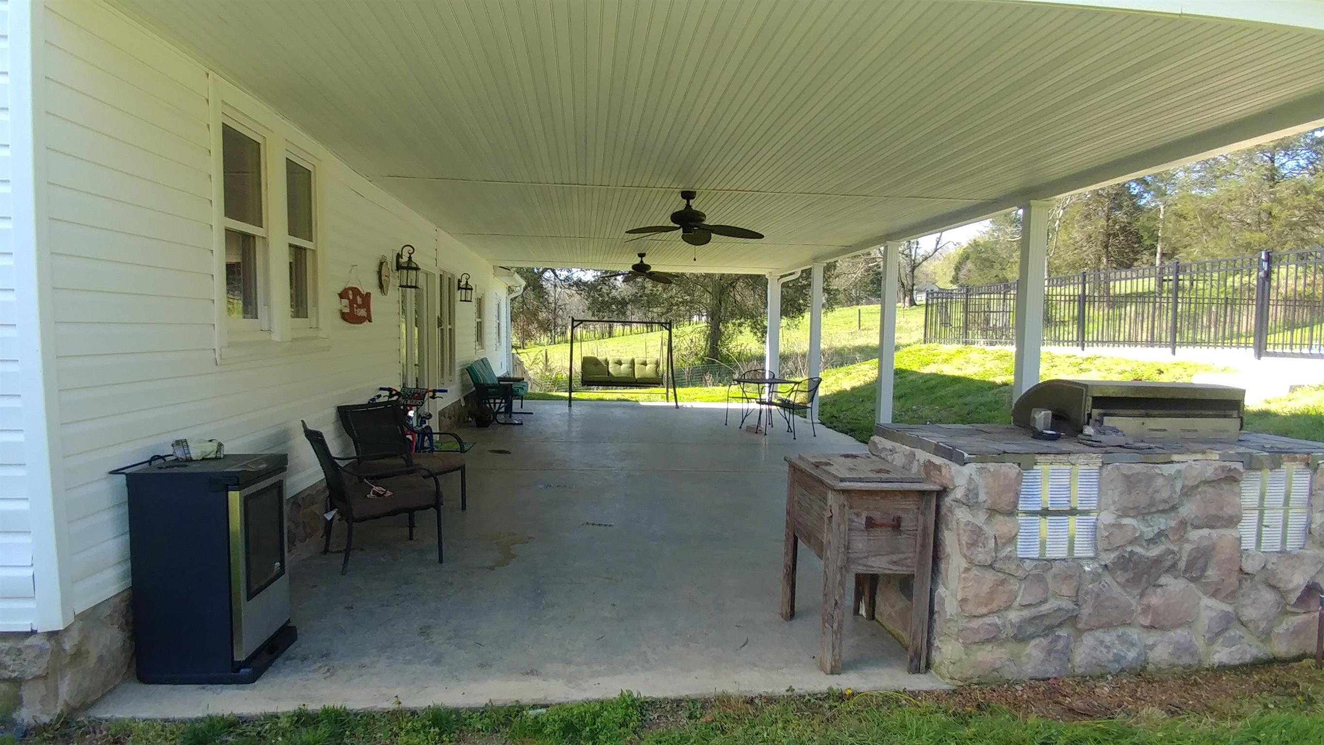 322 Gimlet Road Fayetteville, TN 37334 - Photo 22 of 30 a view of a patio with table and chairs potted plants with wooden floor
