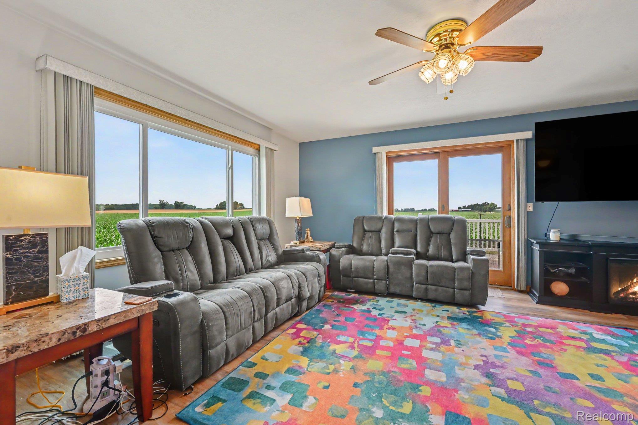 996 Arbogast Road Union City, MI 49094 - Photo 7 of 34 Living area with wood-finish flooring and a ceiling fan