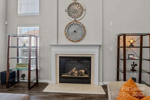 a living room with furniture a rug and a floor