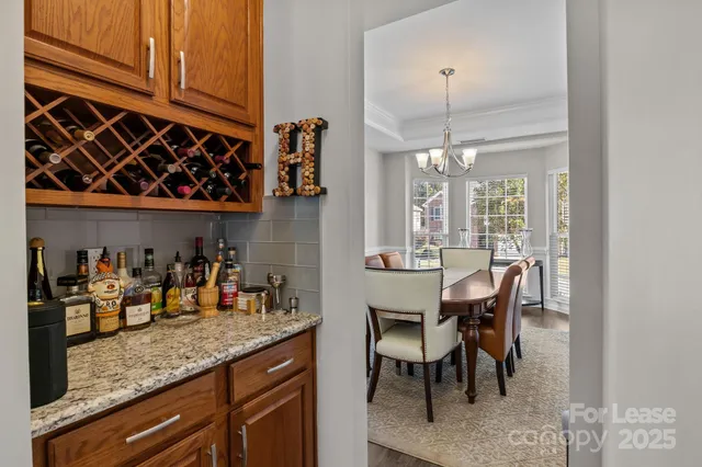 a kitchen with granite countertop a stove and a sink