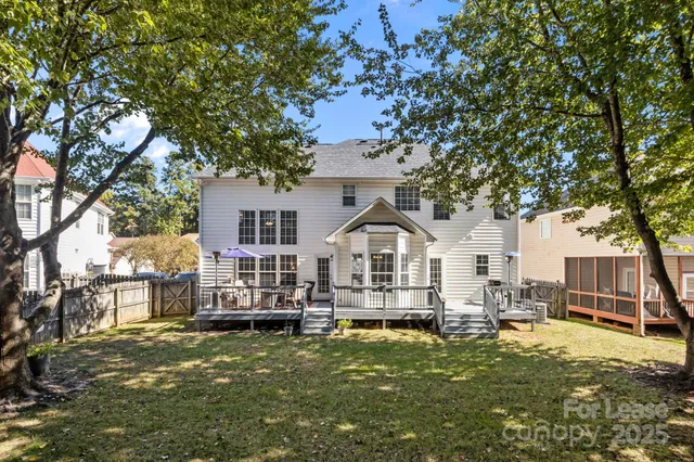 a view of a house with backyard porch and sitting area