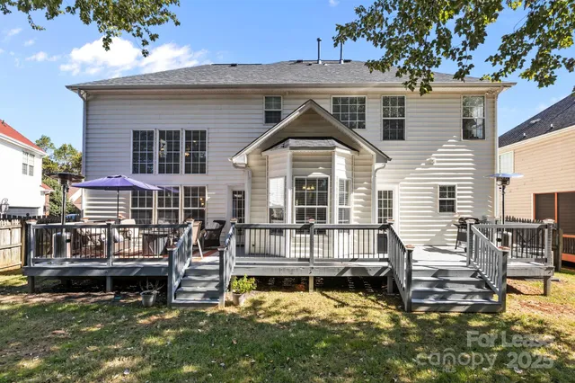 a view of a chairs and table in the balcony