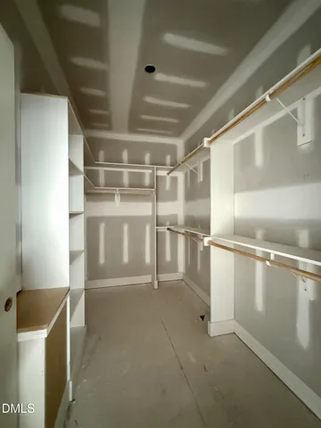 a view of a hallway with bathroom