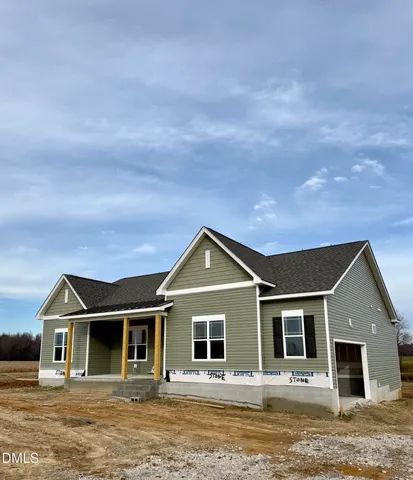 a front view of a house with yard