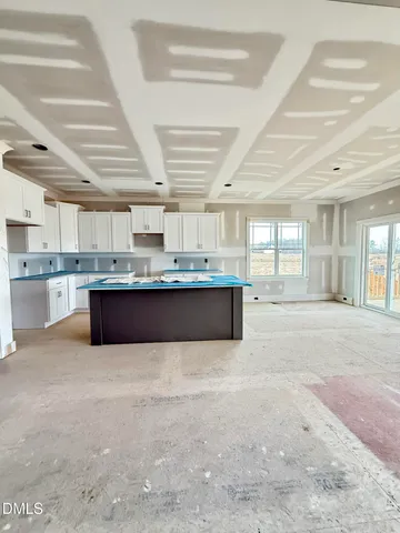 a kitchen with stainless steel appliances granite countertop a stove a sink dishwasher and a refrigerator